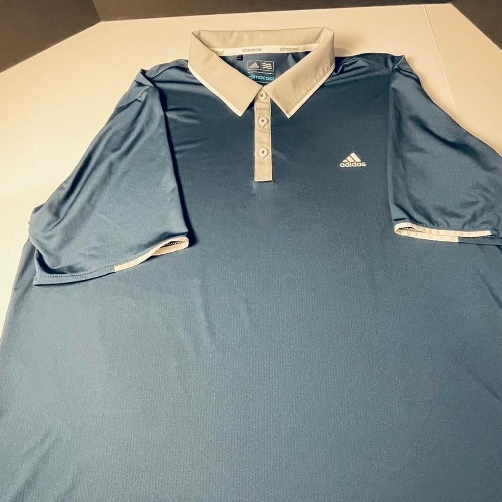 Adidas Climacool XL Men's blue polo golf shirt with solid collar and button up.